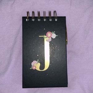 Cute little notebook with a pen !